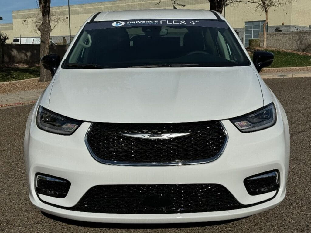 White Chrysler Pacifica with Driverge Rear Entry Manual Fold Out conversion