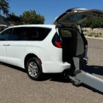 White Chrysler Pacifica with Driverge Rear Entry Manual Fold Out conversion