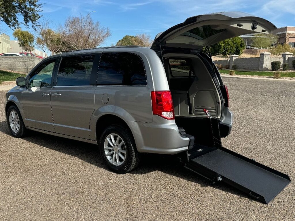 Silver Dodge Grand Caravan with International Sales and Mobility Rear Entry Manual Fold Out conversion