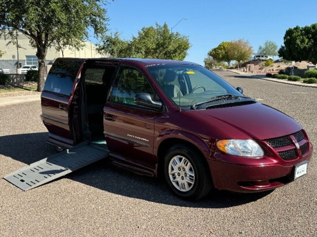 Red Dodge Grand Caravan with BraunAbility Side Entry Automatic Fold Out conversion
