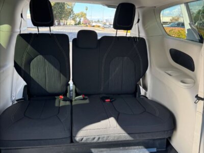 White Chrysler Voyager with Driverge Side Entry Automatic Fold Out conversion