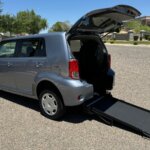 Blue Scion xB with Freedom Motors Rear Entry Manual Fold Out conversion