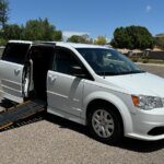 White Dodge Grand Caravan with Other Side Entry Manual Fold Out conversion