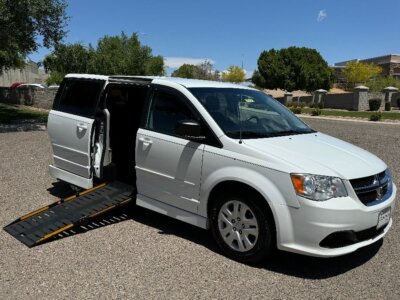 White Dodge Grand Caravan with Other Side Entry Manual Fold Out conversion