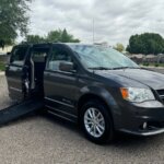 Grey Dodge Grand Caravan with BraunAbility Side Entry Automatic Fold Out conversion