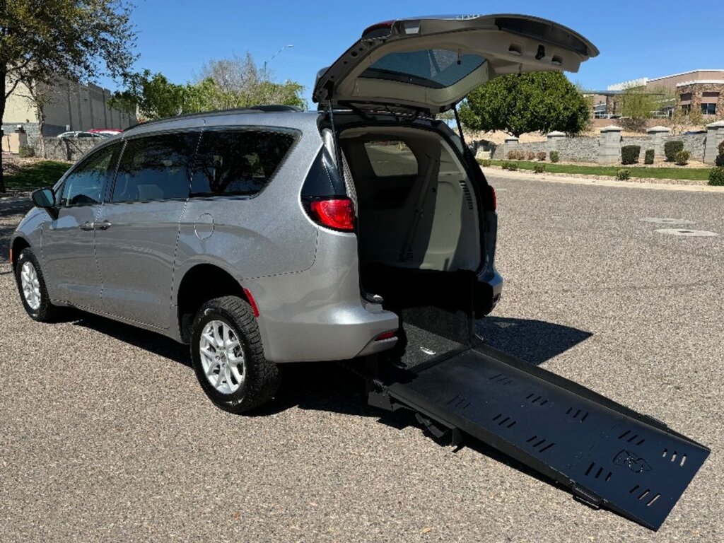 White Chrysler Voyager with Freedom Motors Rear Entry Manual Fold Out conversion