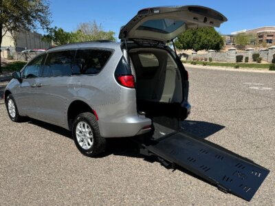 White Chrysler Voyager with Freedom Motors Rear Entry Manual Fold Out conversion