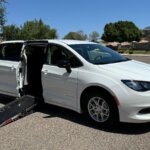 White Chrysler Voyager with Driverge Side Entry Automatic Fold Out conversion