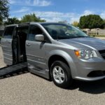 Silver Dodge Grand Caravan with BraunAbility Side Entry Automatic Fold Out conversion
