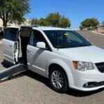 White Dodge Grand Caravan with Adaptive Vans Side Entry Automatic Fold Out conversion