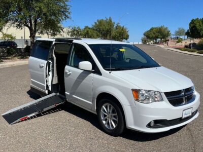 White Dodge Grand Caravan with Adaptive Vans Side Entry Automatic Fold Out conversion