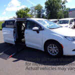 White Chrysler Voyager with Adaptive Vans Side Entry Automatic Fold Out conversion