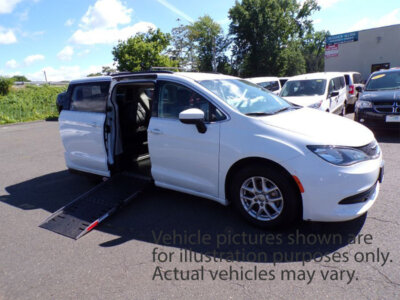 White Chrysler Voyager with Adaptive Vans Side Entry Automatic Fold Out conversion