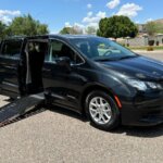 Black Chrysler Voyager with Driverge Side Entry Automatic Fold Out conversion