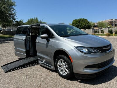 Silver Chrysler Voyager with BraunAbility Side Entry Automatic Fold Out conversion