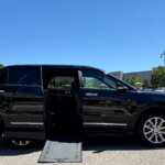 Black Ford Explorer with BraunAbility Side Entry Automatic In Floor conversion