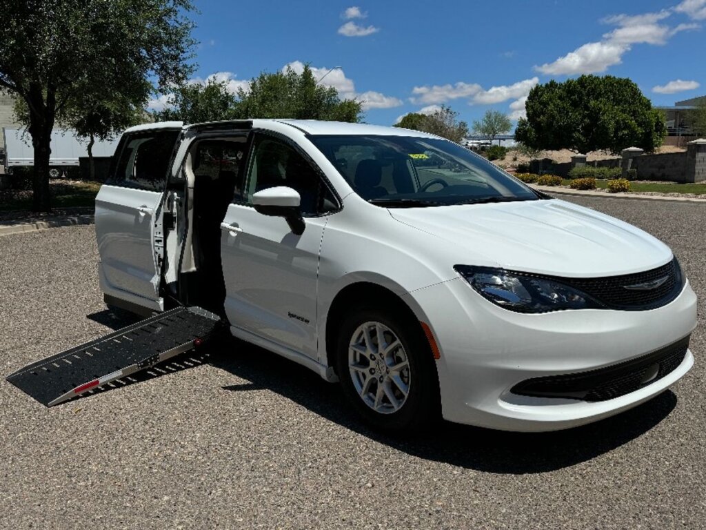 White Chrysler Voyager with Driverge Side Entry Automatic Fold Out conversion