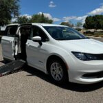 White Chrysler Voyager with Driverge Side Entry Automatic Fold Out conversion