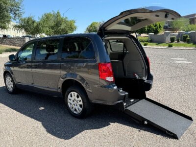 Grey Dodge Grand Caravan with International Sales and Mobility Rear Entry Manual Fold Out conversion