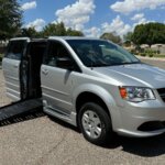 Silver Dodge Grand Caravan with BraunAbility Side Entry Automatic Fold Out conversion