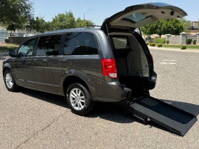 Grey Dodge Grand Caravan with International Sales and Mobility Rear Entry Manual Fold Out conversion