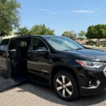 Black Chevrolet Traverse with BraunAbility Side Entry Automatic In Floor conversion