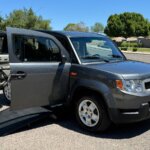 Grey Honda Element with Freedom Motors Side Entry Manual Fold Out conversion