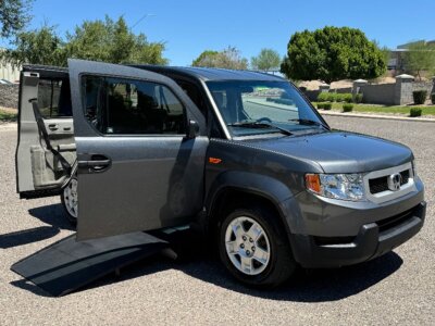 Grey Honda Element with Freedom Motors Side Entry Manual Fold Out conversion