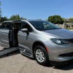 Silver Chrysler Voyager with BraunAbility Side Entry Automatic Fold Out conversion