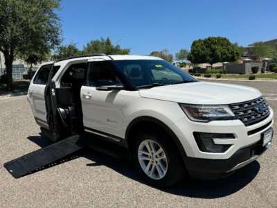 White Ford Explorer with BraunAbility Side Entry Automatic In Floor conversion