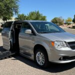 Silver Dodge Grand Caravan with BraunAbility Side Entry Automatic Fold Out conversion
