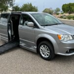 Silver Dodge Grand Caravan with BraunAbility Side Entry Automatic Fold Out conversion