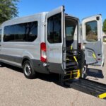 Silver Ford Transit with BraunAbility Rear Entry Automatic Fold Out conversion