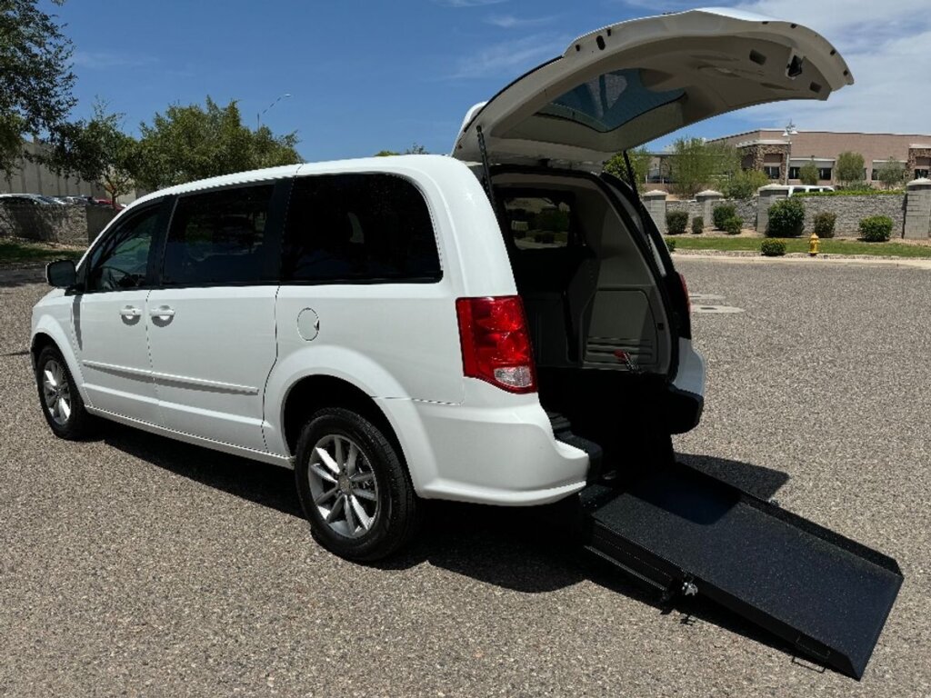 White Dodge Grand Caravan with International Sales and Mobility Rear Entry Manual Fold Out conversion