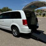 White Dodge Grand Caravan with International Sales and Mobility Rear Entry Manual Fold Out conversion