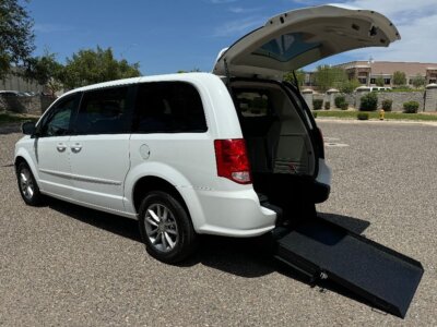 White Dodge Grand Caravan with International Sales and Mobility Rear Entry Manual Fold Out conversion