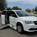 White Dodge Grand Caravan with BraunAbility Side Entry Manual Fold Out conversion
