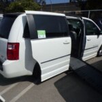White Dodge Grand Caravan with BraunAbility Side Entry Automatic Fold Out conversion