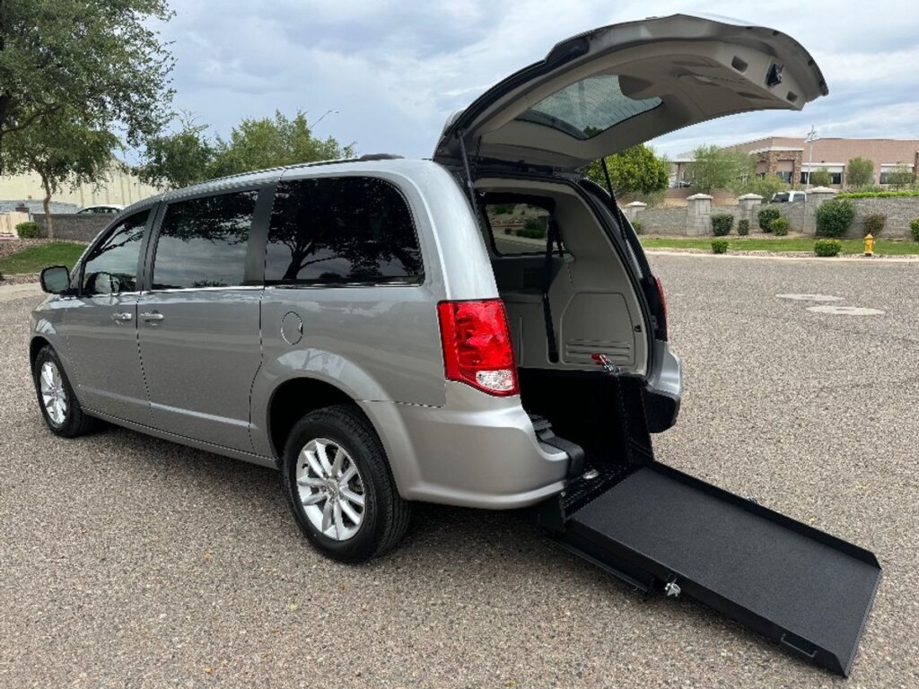 Silver Dodge Grand Caravan with International Sales and Mobility Rear Entry Manual Fold Out conversion