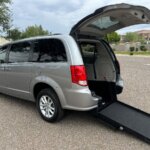 Silver Dodge Grand Caravan with International Sales and Mobility Rear Entry Manual Fold Out conversion