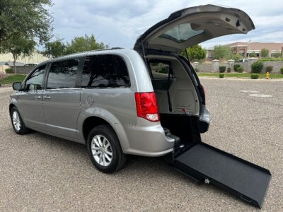 Silver Dodge Grand Caravan with International Sales and Mobility Rear Entry Manual Fold Out conversion