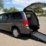 Grey Dodge Grand Caravan with International Sales and Mobility Rear Entry Manual Fold Out conversion