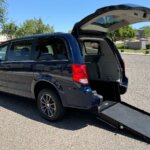 Blue Dodge Grand Caravan with International Sales and Mobility Rear Entry Manual Fold Out conversion