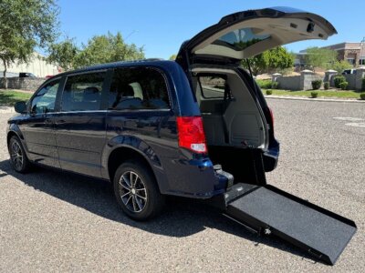 Blue Dodge Grand Caravan with International Sales and Mobility Rear Entry Manual Fold Out conversion