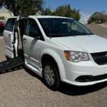 White Dodge Grand Caravan with BraunAbility Side Entry Manual Fold Out conversion