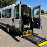 White Ford Transit with BraunAbility Rear Entry Automatic Fold Out conversion