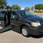 Black Chrysler Town and Country with Vantage Mobility Side Entry Automatic In Floor conversion