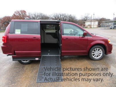 Red Dodge Grand Caravan with Adaptive Vans Side Entry Automatic Fold Out conversion
