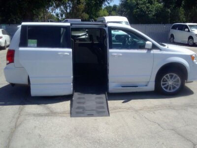 White Dodge Grand Caravan with BraunAbility Side Entry Automatic Fold Out conversion