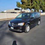 Black Dodge Grand Caravan with BraunAbility Side Entry Manual Fold Out conversion